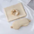 Champagne silk sleep set including eye mask, scrunchie and pillowcase for comfortable rest. - Gold