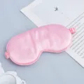 Pink silk sleep mask with elastic strap, soft smooth eye cover for travel and sweet night rest. - Pink
