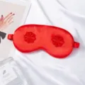 Red silk sleep eye mask with floral embroidery, soft breathable shading for travel and home use. - Red