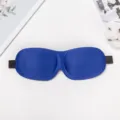 Ergonomic 3D contoured sleep eye mask in deep blue with adjustable elastic strap for travel. - Blue