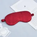 Burgundy double-sided faux silk sleep eye mask with elastic band, perfect for travel and rest. - Burgundy