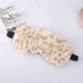 Soft plush leopard print sleep mask with black elastic strap for comfortable daily resting. - Fine Leopard Print / Cream