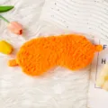Mascherina per dormire in peluche arancione carina con morbida texture e comoda fascia elastica. - Arancione