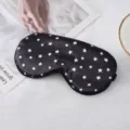 Mascara de dormir de seda negra con estampado de estrellas blancas, suave y comoda para viajes. - Negro