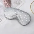 Silver satin sleep eye mask with white star print, comfortable and adjustable for travel. - Gray