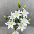 Close-up of artificial white lily flower arrangement with green buds in an elegant vase. - No. 2