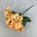 Close-up detail of artificial yellow hydrangea flowers with multi-fork silk petals and green leaves. - Orange Brown