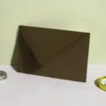 Brown laser cut lace triangular envelope variant for wedding invitation cards. Perfect stationery style. - Coffee
