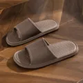 Brown EVA home slide sandals with striped upper and anti-slip diamond footbed for indoor bathroom wear. - Coffee