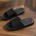 Black EVA home slippers for summer, anti-slip indoor couple bathroom shoes with ribbed strap. - Black