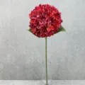 Detailed view of artificial red hydrangea flower stem in clear glass vase for home decor. - Red