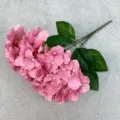 Close-up detail of artificial hydrangea flower petals and green leaves, delicate silk texture. - Autumn Pink