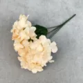 Close-up detail of champagne artificial hydrangea flower branch with realistic green leaves. - Dark Champagne