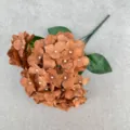 Detail shot of brown artificial hydrangea flower head with realistic silk petals and green stem. - Chocolate