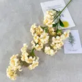 Artificial cream flower branch for home decor, delicate simulation plant detail view. - Champagne