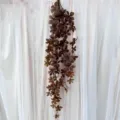 Artificial hanging plant vine for home wall decoration, fake leaves garland for store decor. - Coffee