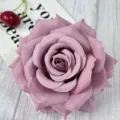 Close-up detail shot of a purple artificial rose flower head with full petals and realistic texture. - Dusty Pink