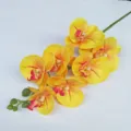 Detailed close up shot of artificial yellow phalaenopsis orchid flower branch with texture. - 7 Heads / Yellow