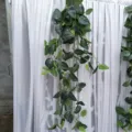 Artificial hanging plant vine with white spotted leaves, perfect for wedding and wall decor detail. - White Polka Dot