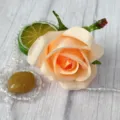 Close-up view of artificial peach rose flower head detail for decorative crafting projects. - Champagne