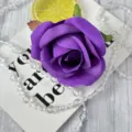 Purple artificial rose flower head detail, brushed fabric material for wedding and event decor. - Purple