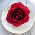 Close-up detail of dark red artificial rose flower head, perfect for DIY crafts and decor. - Bright Red