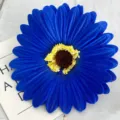 Detailed close-up view of vibrant blue artificial gerbera daisy flower head for decor. - Sapphire Blue