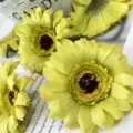 Artificial yellow chrysanthemum flower heads detail shot, perfect for table decor and floral crafts. - Green