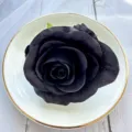 Black artificial rose detail, close up view for table decoration, floral craft and wedding prop. - Gray