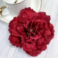 Detailed close-up of a deep red artificial peony flower head with rich layered petals. - Red