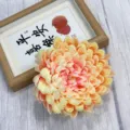 Artificial chrysanthemum flower head, peach yellow gradient fabric floral decor detail. - Pink Heart Champagne