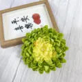 Artificial green chrysanthemum flower head, detailed close-up for floral arrangement decor. - Green