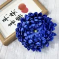 Detailed view of a deep blue artificial chrysanthemum flower head, ideal for decor. - Dark Blue