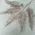 Artificial fern leaf detail closeup for plant wall decoration and home interior design - Dark Coffee