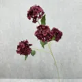Detailed view of 4-head artificial hydrangea bouquet in glass vase for home decor and weddings. - Dark Red