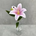 Close-up detail of realistic 3D printed artificial pink lily flower displayed in clear glass vase - Light Purple