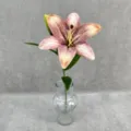 Detailed view of a realistic 3D printed artificial lily flower in a clear glass vase for decor. - Autumn Light Coffee