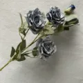 Detailed close-up of artificial blue rose flower head, showing realistic petals and texture. - Mist Blue