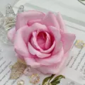Close-up of pink artificial rose flower head, perfect for wedding floral decor details. - Color 9