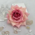 Close up of artificial pink rose flower head, fabric material, delicate petals for DIY crafts. - Pink White Gradient
