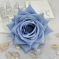 Closeup of blue artificial rose flower head, perfect for wedding decor, DIY crafts, and floral boxes. - Blue