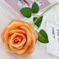 Single artificial orange rose flower with green leaves for home wedding decor and floral arrangement. - Dark Orange