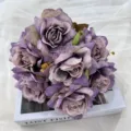 Elegant artificial purple rose bouquet with 7 heads, perfect for home decor and wedding arrangement. - Deep purple
