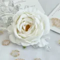 White artificial curled peony rose flower head detail for DIY crafts and wedding decor. - White