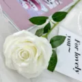 Single artificial white rose flower for wedding home decor and floral arrangement. - Cream