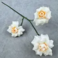 Artificial rose branch with three cream peach flower heads for home wedding floral decor. - Champagne