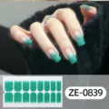 Close-up detail of sparkly green gradient nail wraps on hand model with sticker sheet view. - Green Glitter Style (ZE-0839) / Press-on Nails and Nail File