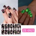 Close-up detail of Halloween glow-in-the-dark skull nail wraps showing vibrant night effect. - Halloween Skull Flower Style (ZE-0921) / Press-on Nails and Nail File