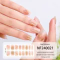 Adesivi per unghie in gel semi-polimerizzato con elegante sfumatura nude e linee dorate. - NF240021