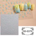 Detailed view of 5D embossed blue floral nail art stickers with elegant gradient yellow tips. - 5D-0379 / 85*100mm Blank Sheet